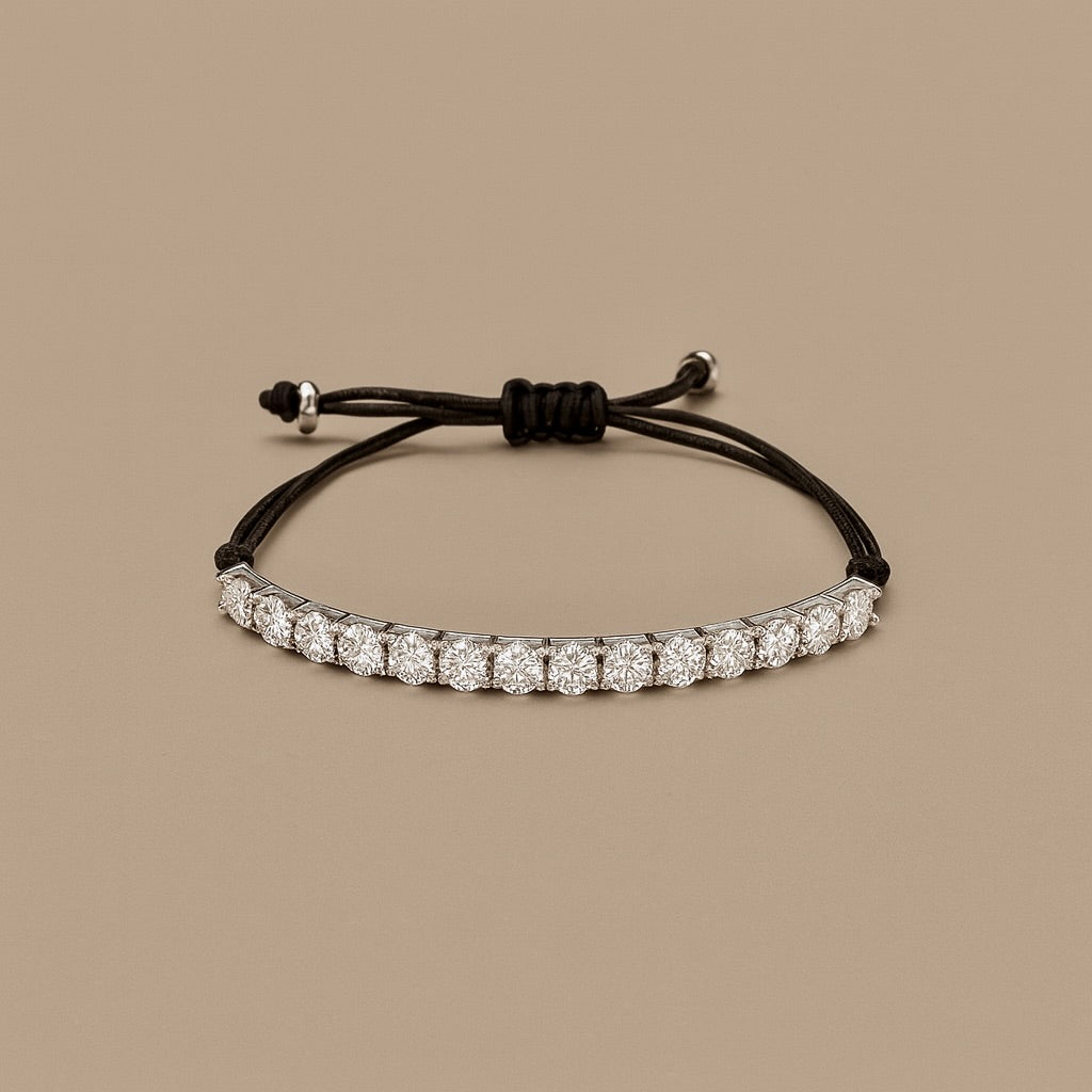 Bracciale tennis con cordino oro 18 kt